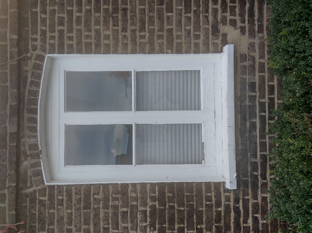 Figure 92 Timber casement window with simple rounded brick arch at 163 High Street