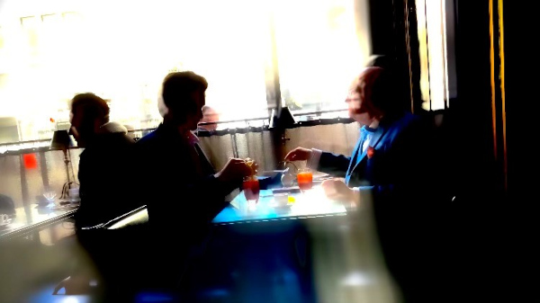 Two figures sat opposite each other drinking their Bloody Marys.